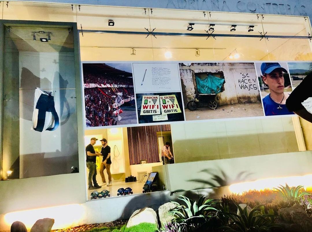 A glass window showcasing pictures of the artworks produced in MATZA Edgelands Cúcuta
